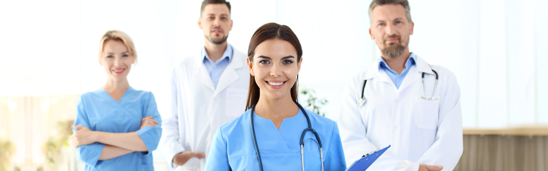 Medical professionals smiling for the camera