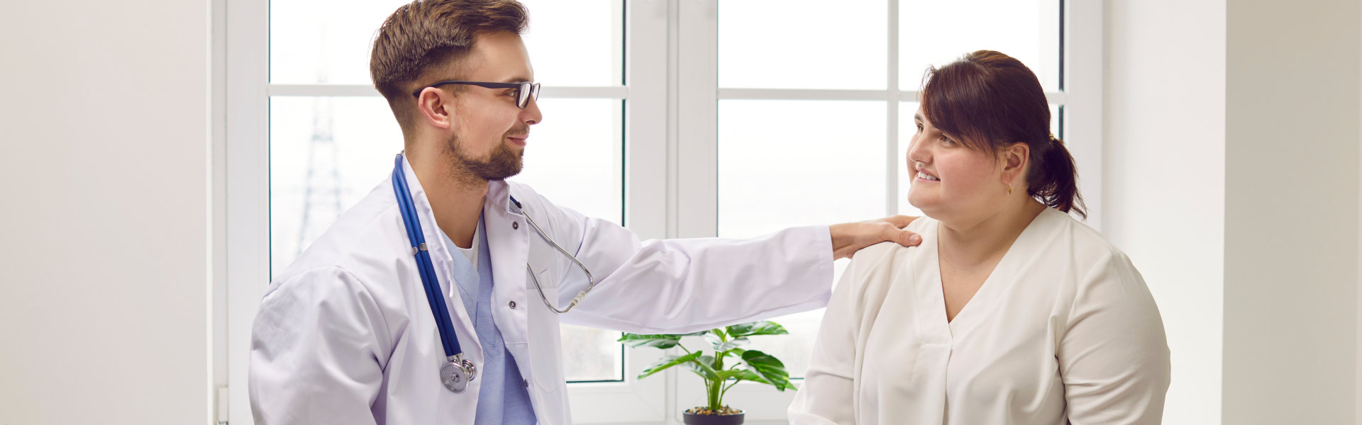 Doctor and patient smiling at each other